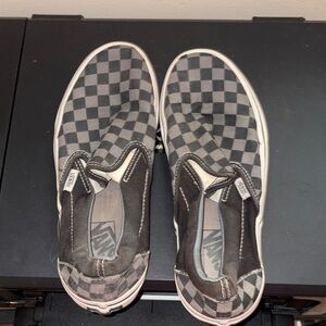 Vans Slip-On Canvas Sneakers in Black and Tan